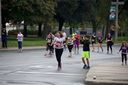 Proud Adam taking photos of his mom Nadine Ibrahim as she completes the 21K run in support of CAI Academy. 