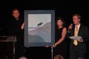 Joe Cressy, Director of Campaigns and Community Outreach at the Stephen Lewis Foundation,  auctions a Charles Pachter painting.